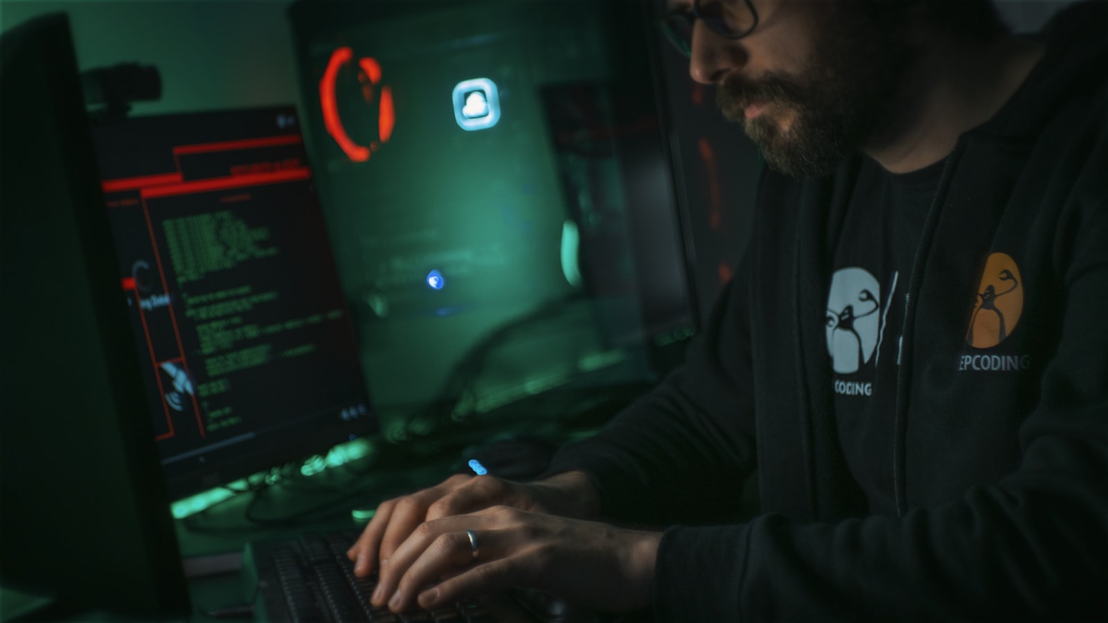 A person working at a terminal, representing adversarial testing and monitoring