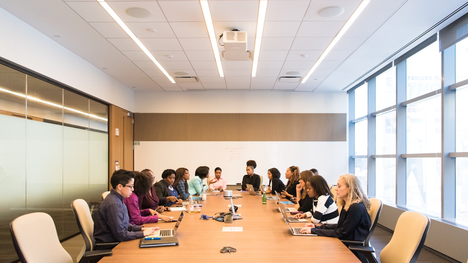 A team working through roles and responsibilities in a meeting room